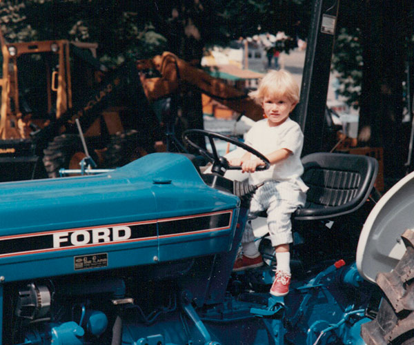 Young Nic Bozzo on a tractor